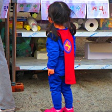 It was a superhero parade; she must have been all tuckered out because her own Dad-hero was indulgently getting her energy boosting ice cream.